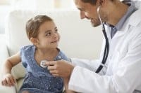 Doctor examining girl